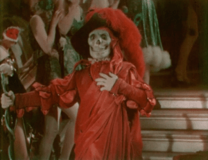 The Phantom appears at the Grand Masque Ball, dressed as the Red Death from Edgar Allan Poe's short story 